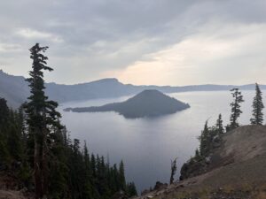 Even the smoke filled air from a massive and destructive wildfire will not deter the unique and incredible beauty of Wizard Island and Crater Lake Park.