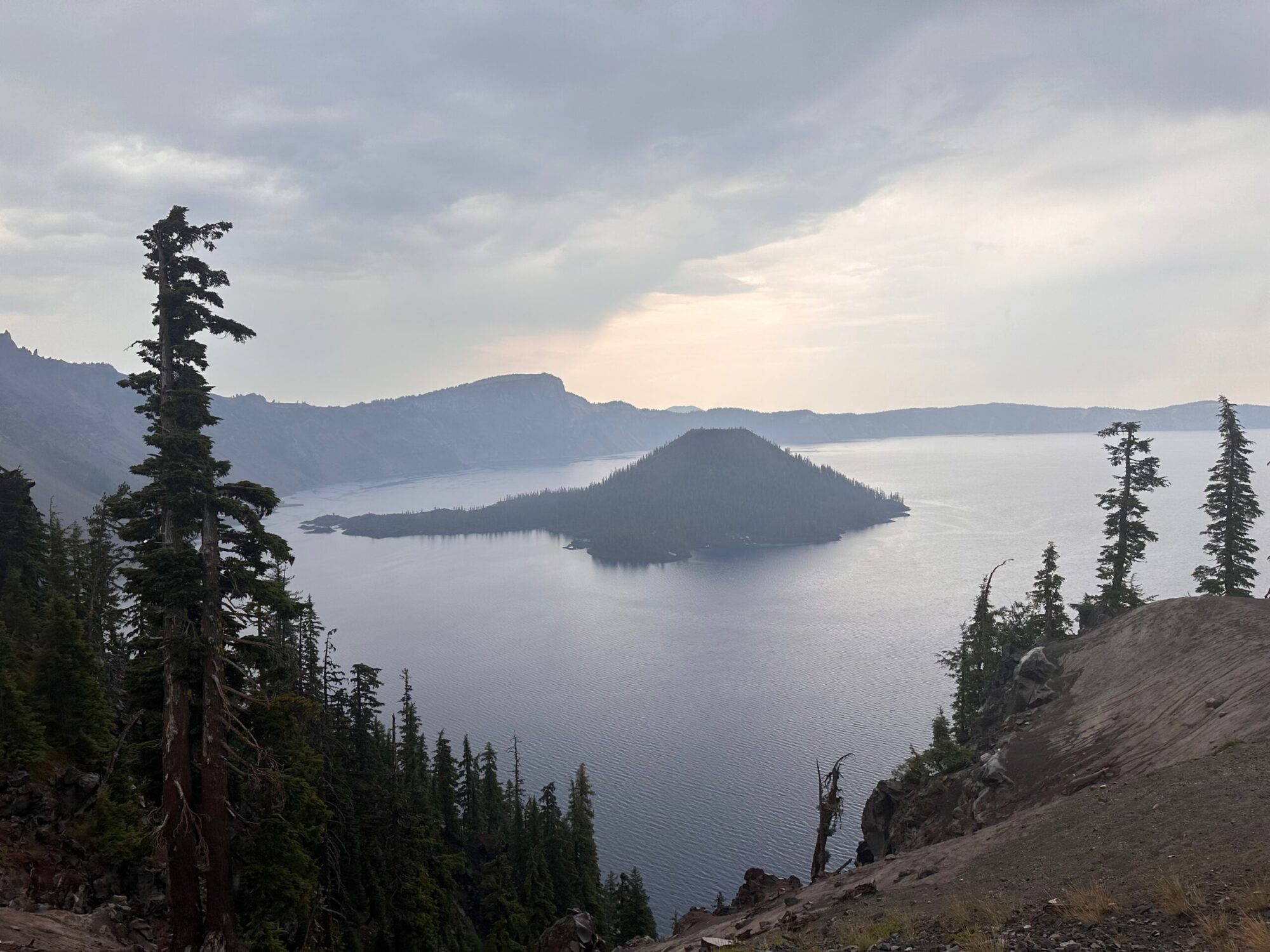 Even the smoke filled air from a massive and destructive wildfire will not deter the unique and incredible beauty of Wizard Island and Crater Lake Park.