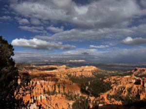 Clouds cast shadows on the hoodoo landscape.